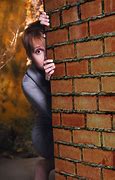 Image result for A Stressed Girl Hiding Behind a Wall