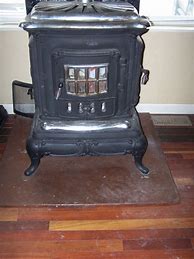 Image result for Antique Cast Iron Wood Heaters