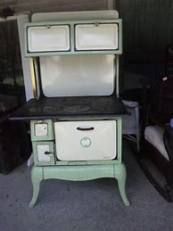 Image result for Ger Antique Wood Stove with Porcelain