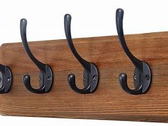 Image result for wooden clothes hangers wall