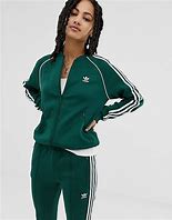 Image result for Adidas Green Jacket Mixed with Brown Jeans