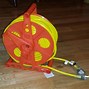 Image result for Roll Up Extension Cord Reel