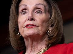 Image result for Nancy Pelosi with African Scarf