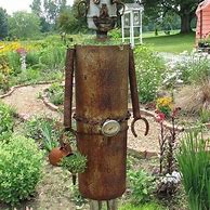Image result for Funky Garden Art Made From Junk