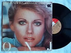Image result for Olivia Newton-John Greatest Hits Album Cover Artwork