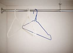 Image result for Using a Coat Hanger to Hold a Door Shut
