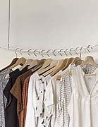 Image result for Clothes Hanger Ideas for Laundry Room