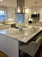 Image result for Kitchen with White Cabinets Tan Countertops Quartz