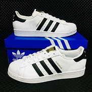 Image result for Adidas High Tops Shell Toe Trainers