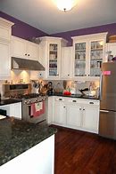 Image result for Antique White Kitchen Cabinets with Black Appliances