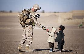 Image result for Soldier Helping Child