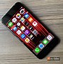 Image result for Holding iPhone SE 2020
