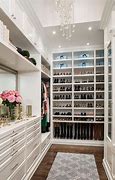 Image result for Walk-In Closet with Window and Designer Clothes
