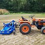 Image result for Orange Kubota Tractor