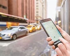 Image result for Uber sets sights on profits  