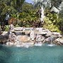 Image result for Pool with Grotto Waterfall