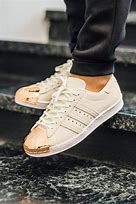 Image result for Black Adidas Shell Toe with Orange Accent
