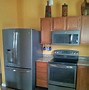 Image result for GE Slate Appliances with Oak Cabinets