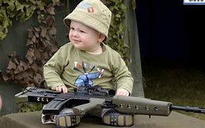 Image result for Pics of Baby with Gun
