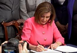 Image result for Nancy Pelosi Pens Slogan during Signing