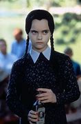 Image result for Wednesday the Addams Family Drinking Poison