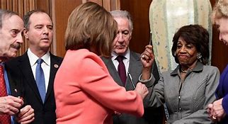 Image result for Pelosi Passing Out Pens
