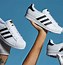 Image result for Adidas with Brown or Gold Stripes
