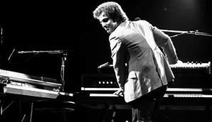 Image result for Elton John Singing at Piano