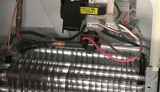 Image result for Defrost Thermostat for a Woods Upright Freezer