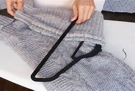 Image result for Stretched Sweater On Hanger