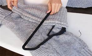 Image result for How to Fold Sweaters On Hanger