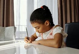 Image result for Child Doing Homework at Desk