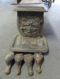 Image result for Antique Decorative Oval Cast Iron Wood Stove