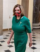 Image result for Nancy Pelosi in Tan Dress