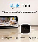 Image result for Blink Mini - Compact Indoor Plug-In Smart Security Camera, 1080 HD Video, Night Vision, Motion Detection, Two-Way Audio, Works With Alexa - 1 Camera