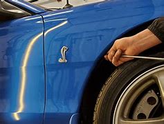 Image result for Removing Dents in Car Panels