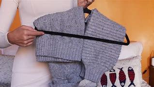 Image result for Sweater On a Cloth Hanger
