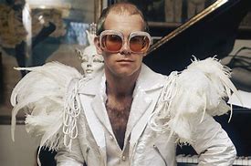 Image result for Elton John Outfits That He Performed in Duck