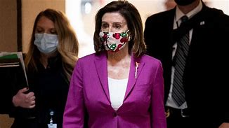 Image result for Nancy Pelosi in Yellow Dress