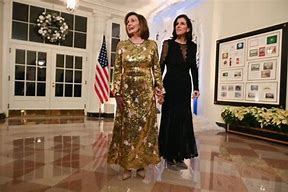 Image result for Nancy Pelosi Black Dress Gold Pin