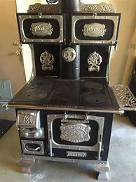 Image result for Antique Home Comfort Cook Stove