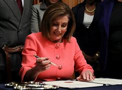 Image result for Pelosi Walking with Her Impeachment Pens