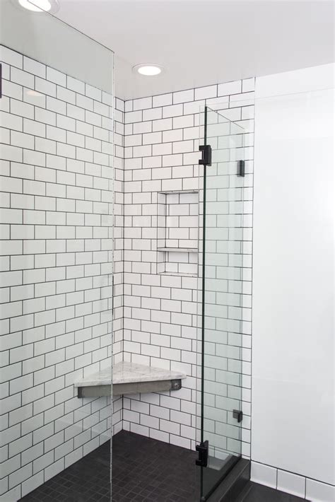 Shower with white subway tile and dark grout   White subway tile shower  