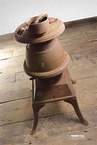 Image result for Old Cast Iron Pot Belly Stove