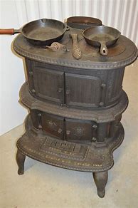 Image result for Ornate Cast Iron Wood Stove
