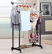 Image result for Clothes Folding Table and Hanger Rack