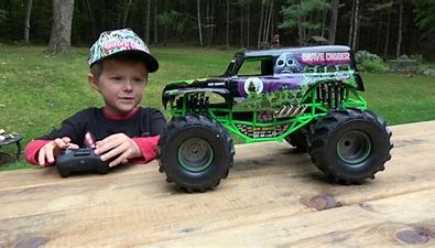 Image result for images little boys with toy monster trucks