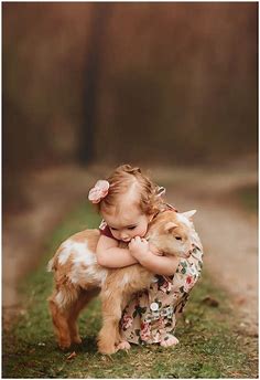 A baby girl and her goat - Andrea Martin Photography