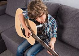 Image result for Kids Playing Acoustic Guitar