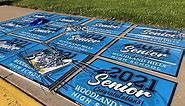 Woodland Hills teachers deliver congratulatory yard signs to seniors